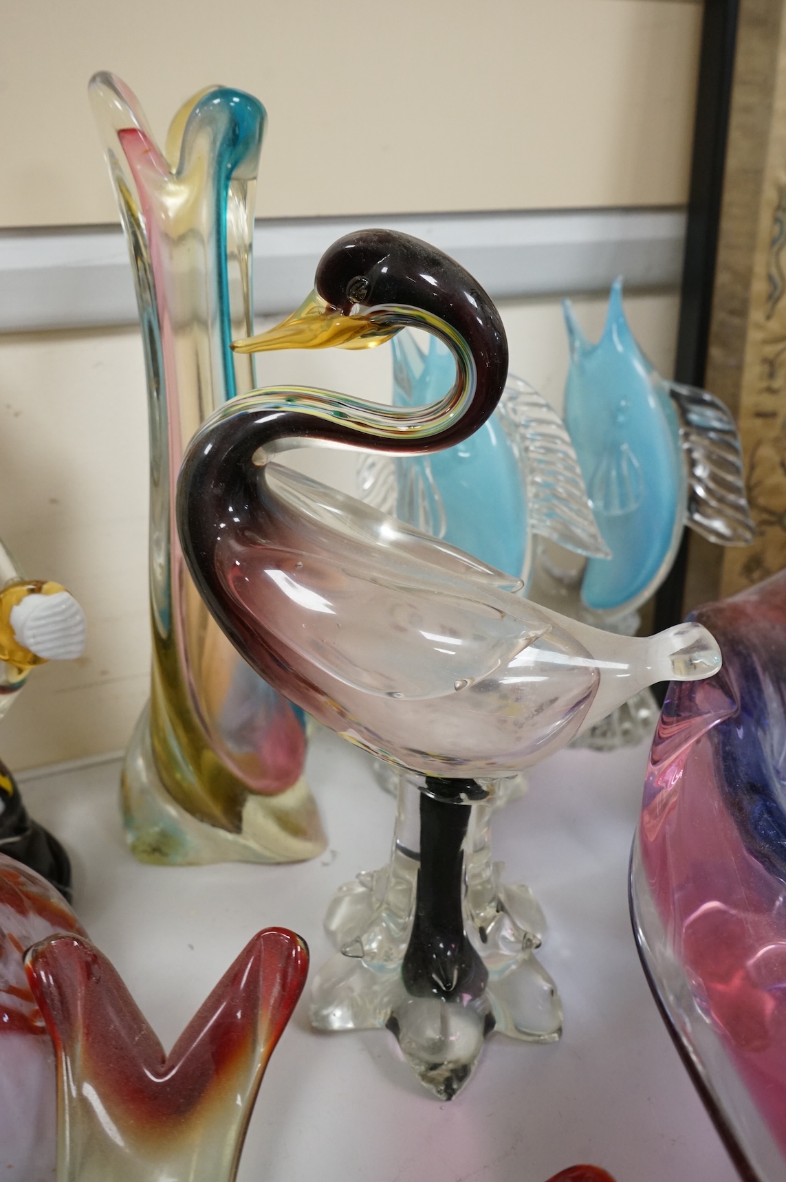 Two multi-coloured Murano glass clowns, a pair of 'fish' vases and modernist glassware, tallest 32cm